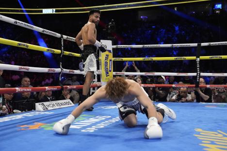 Boxer Naoya Inoue knocked down in a boxing match.