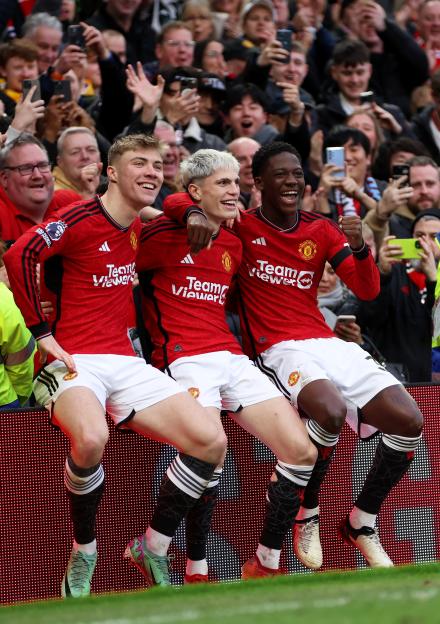 Manchester United players celebrating a goal.