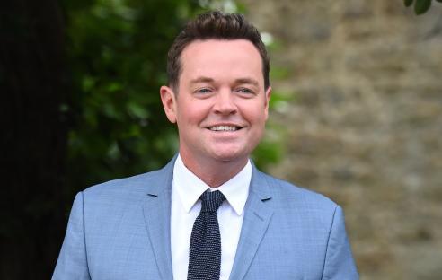 Stephen Mulhern arriving at a wedding, wearing a light blue suit.