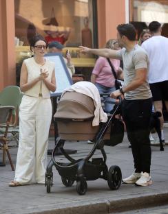 Michelle Keegan and Mark Wright with their baby in a stroller.