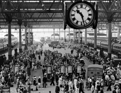 Waterloo Station crowded with holidaymakers waiting for trains to the South Coast.