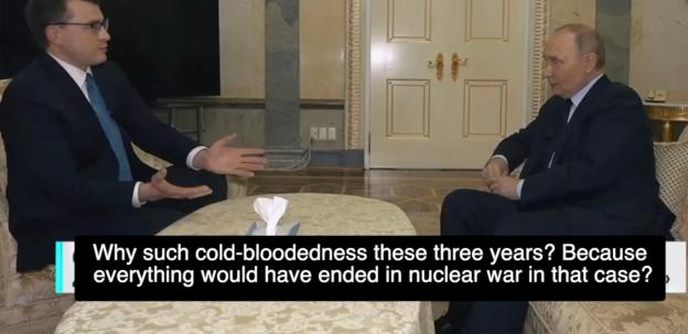 Vladimir Putin in an interview discussing the war in Ukraine.