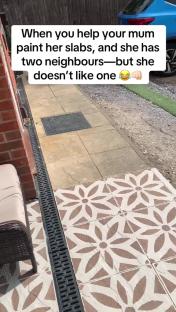 Painted patio slabs with a flower design.