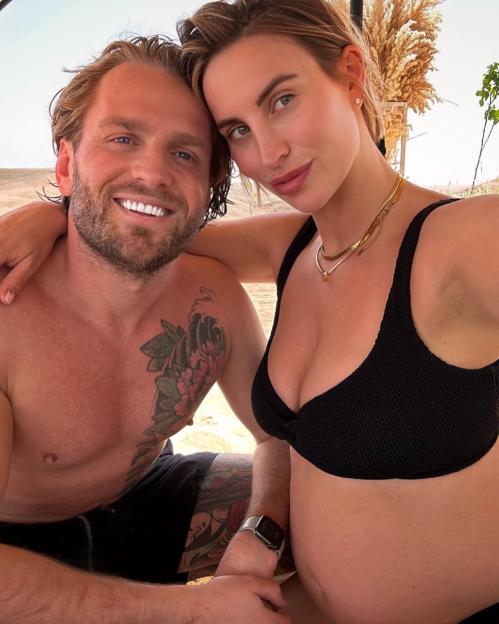 Pregnant Ferne McCann and her partner cuddling.