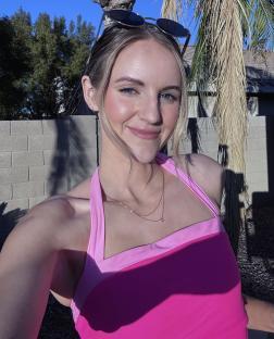 Woman in pink halter top.