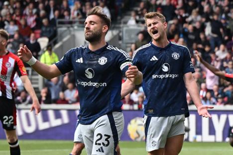 Luke Shaw reacts after scoring an own goal.