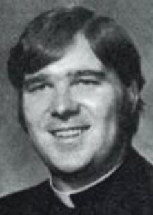 Black and white photo of Father James M. Ray.
