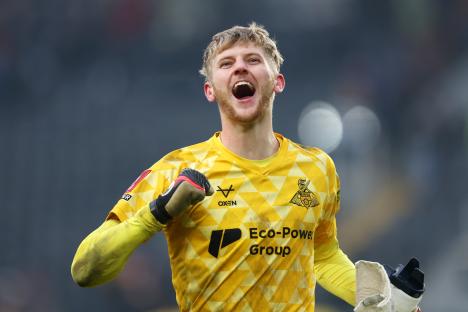 Teddy Sharman-Lowe of Doncaster Rovers celebrates a soccer victory.