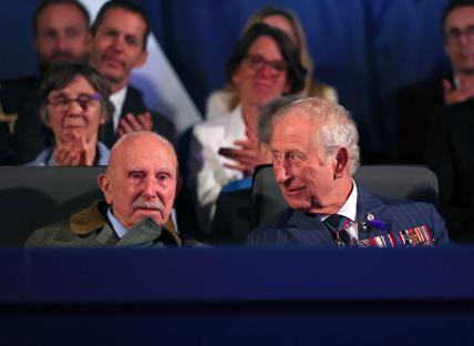 King Charles III and a veteran at a VE Day concert.