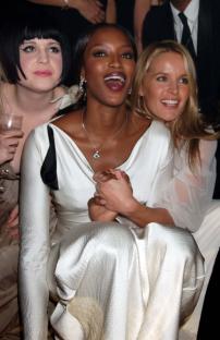 Kelly Osbourne, Davinia Taylor, and Naomi Campbell at a party.