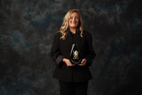 Erin Cuthbert holding her Chelsea Women's Player of the Season award.