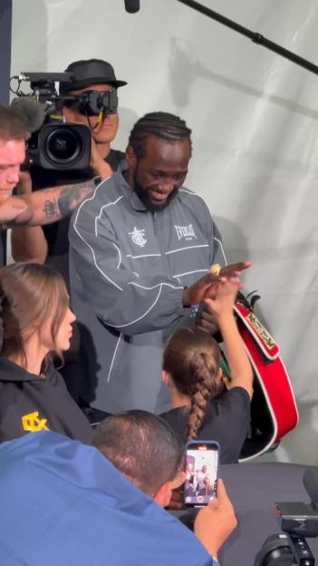 Terence Crawford post-fight, showing off his championship belt.