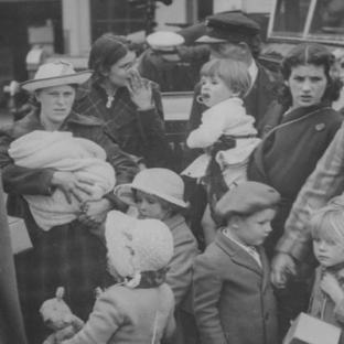 Black and white photo of women and children during World War II.