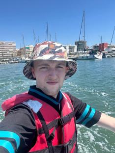 Man in Benidorm wearing a life vest on a boat.