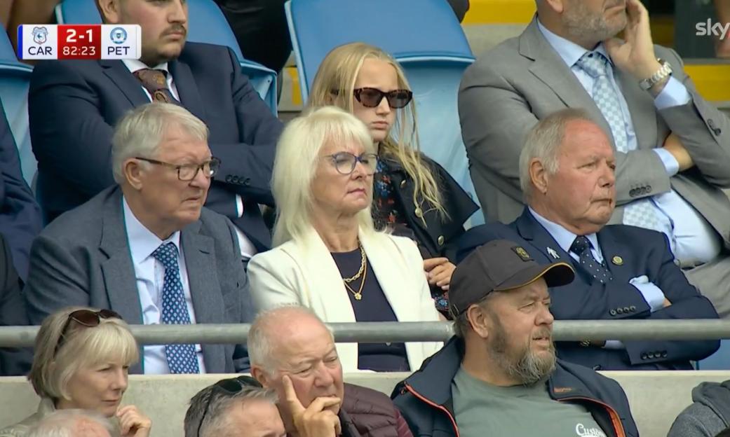 Spectators watching a soccer game.