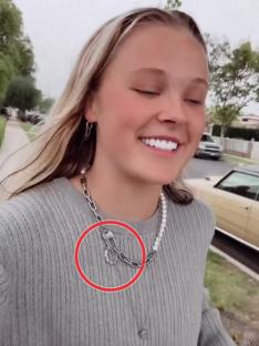 Jojo Siwa wearing a necklace.