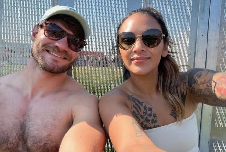 A couple posing for a selfie.