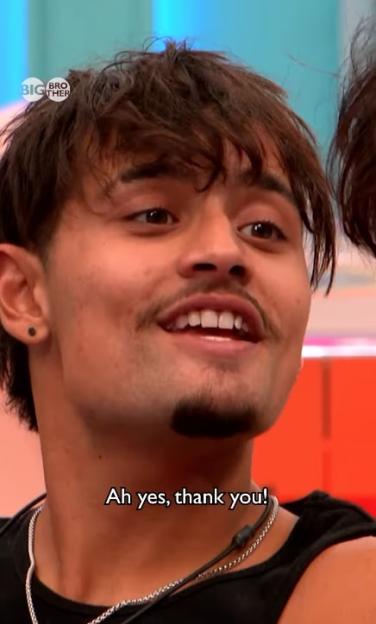 Sam from Big Brother smiling and saying "Ah yes, thank you!"