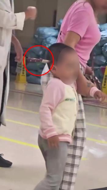 Toddler with knife in head arriving at hospital.