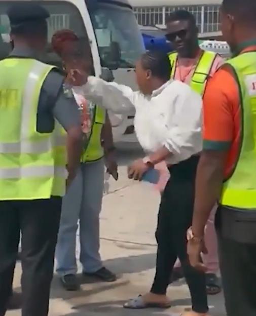 A woman arguing with security personnel.