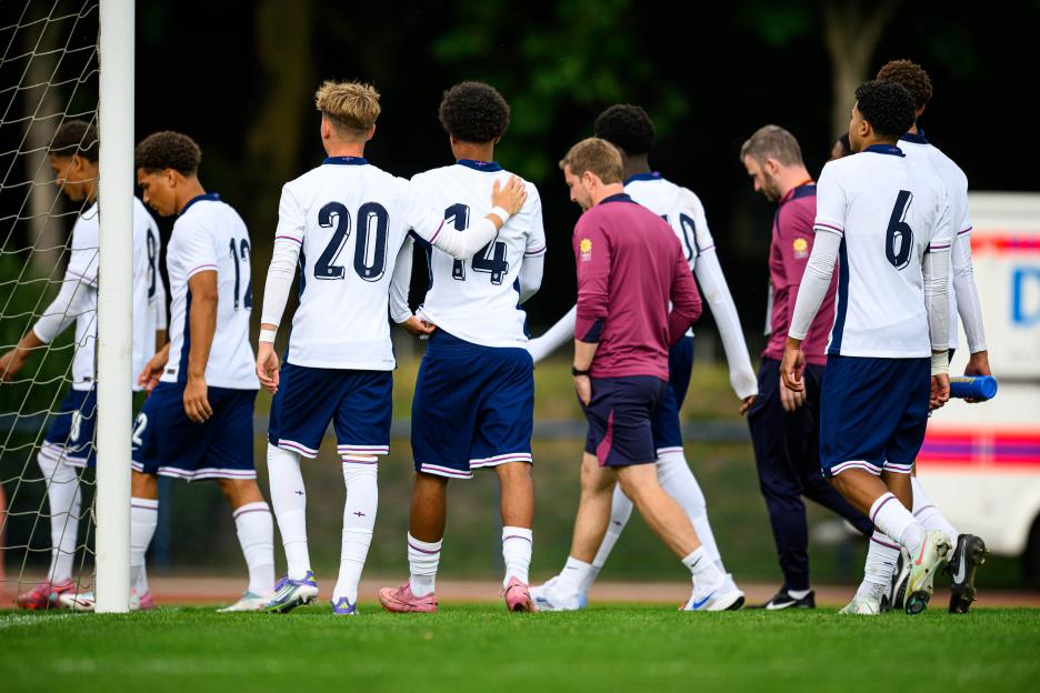 England soccer players leaving the pitch.