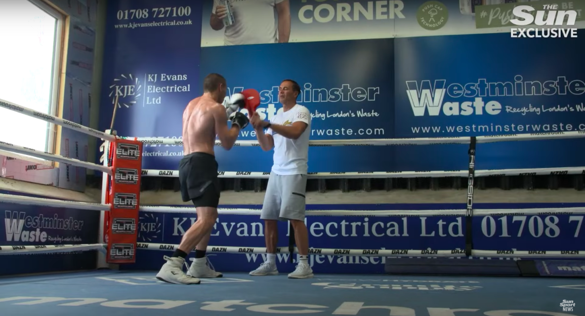 Boxer training in a boxing ring.