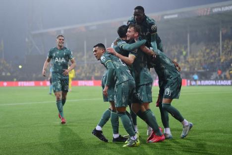 Tottenham Hotspur players celebrating a goal.