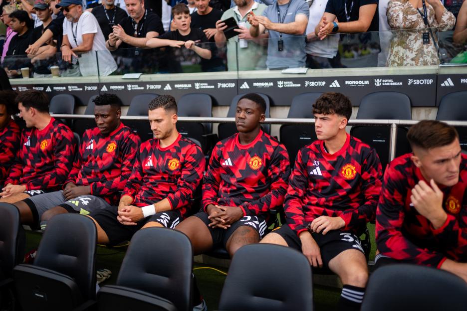 Manchester United players on the bench.