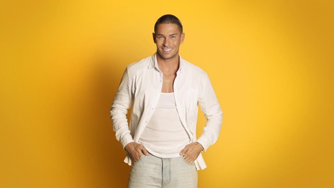 Joey Essex smiling for "The Box" TV show.