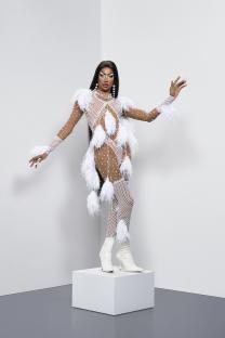 Tayce in a white feathered outfit.