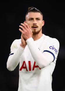 Radu Dragusin of Tottenham Hotspur applauding fans.