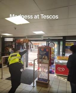 Astonishing moment Tesco staff lob metal baskets and crates at ‘shoplifter’ in fierce standoff as terrified shoppers gawp