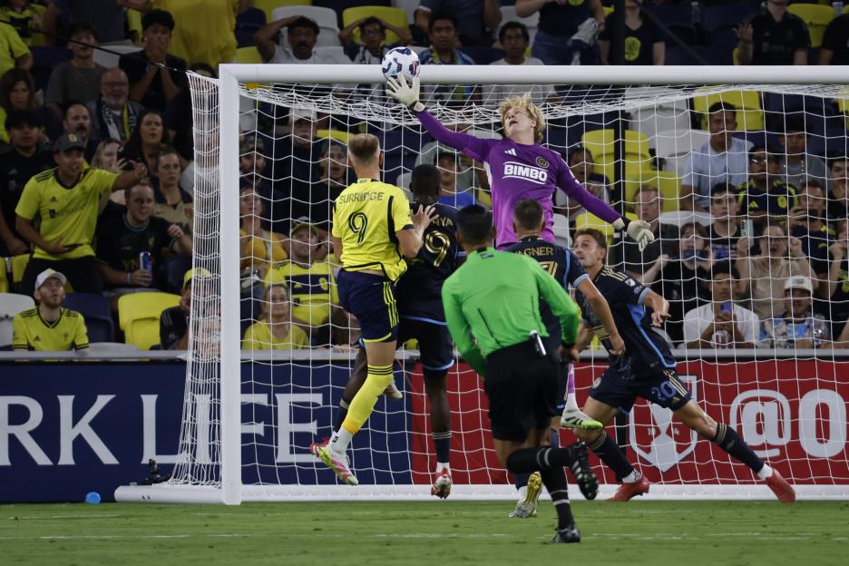 Nashville SC forward Sam Surridge #9 heads a ball into the goal past Philadelphia Union goalkeeper Andrew Rick #76.