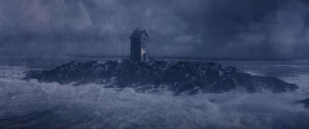 A small stone house on a rocky island during a storm.