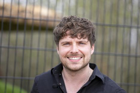 Portrait of Cam Whitnall, director of a big cat sanctuary.