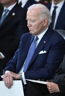 President Biden seated at an inauguration ceremony.