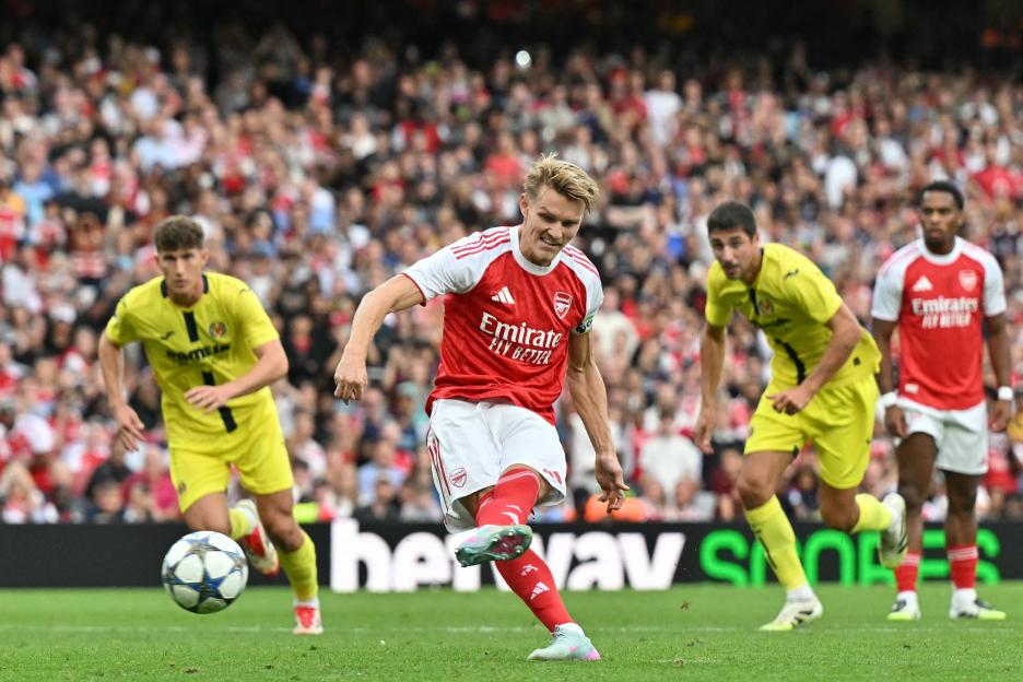Martin Ødegaard scoring a penalty kick for Arsenal.