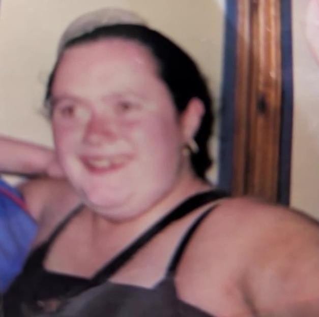 Photo of a woman smiling.