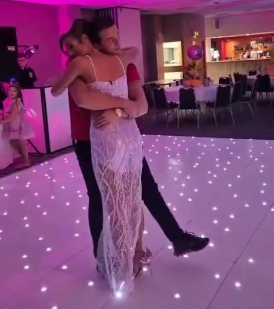 Venezuela Fury and Noah Price dancing on a light-up floor.