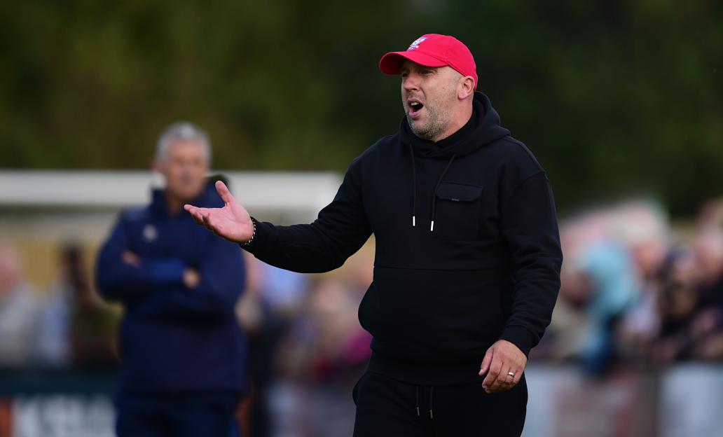 Adam Hinshelwood, manager of York City, coaching during a match.
