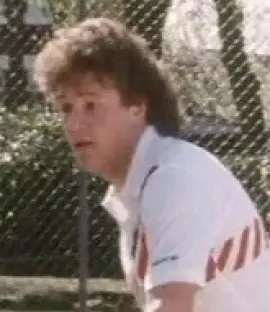 Malcolm Nuttall playing tennis.