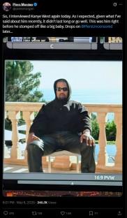 Kanye West sitting on a chair outdoors.