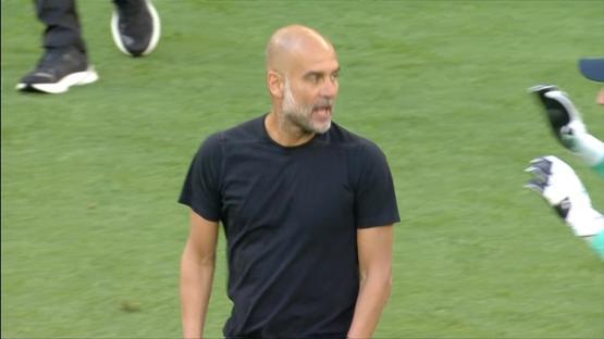 Pep Guardiola on a soccer field.