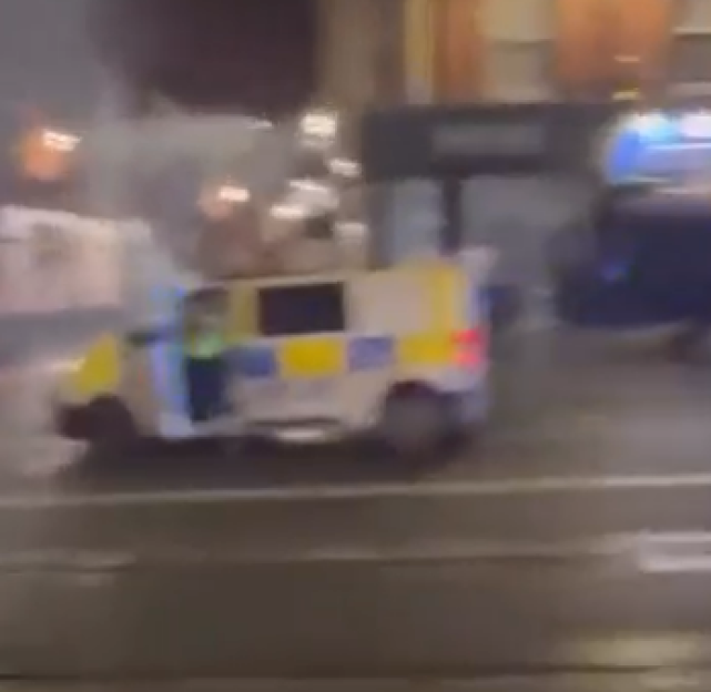 Police vehicle on fire during protests.