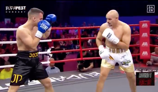Two boxers in a boxing match.