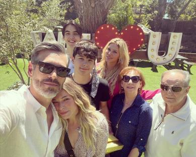 Group photo of Brandi Glanville, Eddie Cibrian, Leann Rimes, and their families at an Easter gathering.