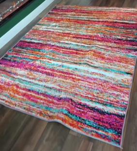 Multicolored striped rug in a living room.