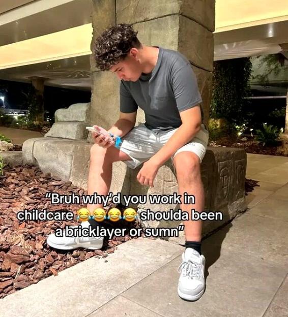Man sitting and looking at his phone with text overlay: “Bruh why’d you work in childcare shoulda been a bricklayer or sum’n”