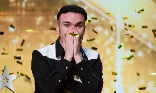 Man reacting in surprise amidst falling confetti.