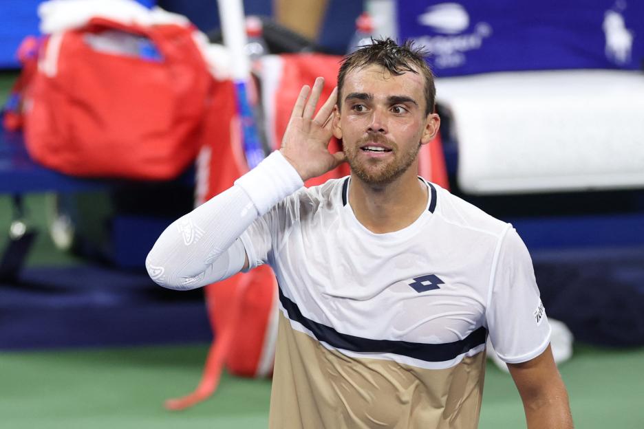 Benjamin Bonzi celebrates a tennis match victory.